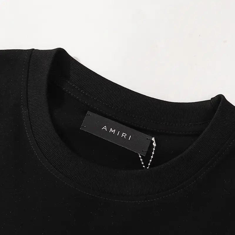 Amiri Staggered Logo T-Shirt: Luxuriöses Baumwoll-Shirt für Herren, Freizeit-Look